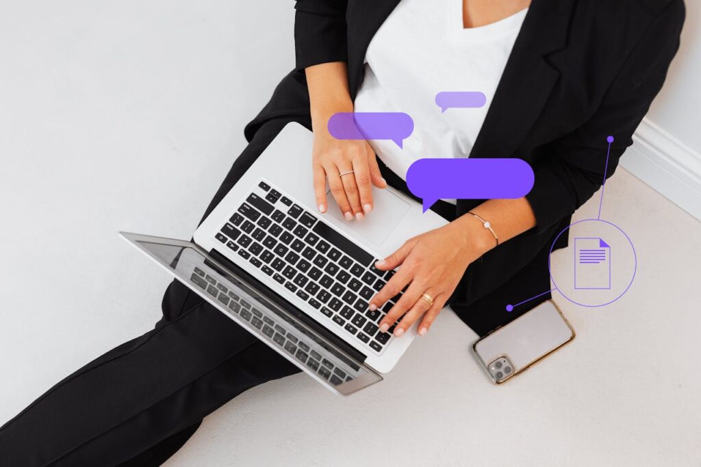 Crafting Captivating Headlines: Your awesome post title goes here High-angle shot of a woman in black suit using a laptop, symbolizing digital communication.